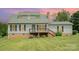 Charming two-story home featuring a welcoming deck and well-maintained lawn at 109 Terrace Pl, Lincolnton, NC 28092