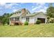 Home exterior with a deck, garage, and manicured lawn at 109 Terrace Pl, Lincolnton, NC 28092