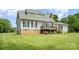 Charming two-story home featuring a welcoming deck and well-maintained lawn at 109 Terrace Pl, Lincolnton, NC 28092