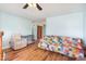 Comfortable living room with wood floors, a recliner, and a vibrant quilt at 109 Terrace Pl, Lincolnton, NC 28092