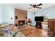 Cozy living room with a brick fireplace and wood floors at 109 Terrace Pl, Lincolnton, NC 28092