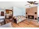 Inviting living room featuring a brick fireplace and a colorful quilt on the sofa at 109 Terrace Pl, Lincolnton, NC 28092