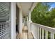 Outdoor wooden balcony with trees and siding, featuring a view of the home's exterior at 11139 Dundarrach Ln, Charlotte, NC 28277