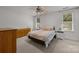Cozy bedroom with two windows, neutral color scheme, and comfortable furnishings at 11139 Dundarrach Ln, Charlotte, NC 28277