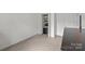 Carpeted bedroom with closet storage space; perfect as a guest room or home office at 11139 Dundarrach Ln, Charlotte, NC 28277
