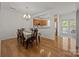 Dining room features hardwood floors and an open view to the kitchen at 11139 Dundarrach Ln, Charlotte, NC 28277