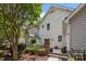 Charming townhouse with well-maintained landscaping, stone accents, and a welcoming front porch at 11139 Dundarrach Ln, Charlotte, NC 28277