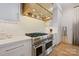 Chef's kitchen with a stainless steel range, custom cabinets, and hardwood floors, perfect for culinary enthusiasts at 1118 Jefferson Dr, Charlotte, NC 28270