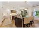 Open-concept kitchen and dining area with a large dining table and modern lighting fixtures at 1118 Jefferson Dr, Charlotte, NC 28270