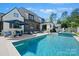 Stunning home exterior with a spacious pool and patio area, perfect for outdoor entertaining at 1118 Jefferson Dr, Charlotte, NC 28270