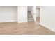 Finished basement featuring light wood floors and a staircase leading to the upper level at 1123 Fern Hill Rd, Mooresville, NC 28117