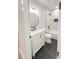 Modern bathroom with black hardware, tile floors and a white vanity at 1123 Fern Hill Rd, Mooresville, NC 28117