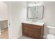 A charming powder room with a granite vanity, modern mirror, and contemporary lighting fixtures at 1123 Fern Hill Rd, Mooresville, NC 28117