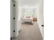 Cozy bedroom featuring neutral walls, a metal bed frame, wood nightstands, and ample natural light at 1123 Fern Hill Rd, Mooresville, NC 28117