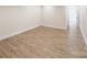 Bright and airy bedroom with wood flooring, white trim, and neutral wall color at 1123 Fern Hill Rd, Mooresville, NC 28117