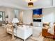 Open living room with a fireplace, modern decor, and natural light at 1123 Fern Hill Rd, Mooresville, NC 28117