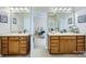 Luxurious bathroom with double vanities, granite counters, and access to the Primary bedroom at 1151 Donelea Nw Ln, Concord, NC 28027