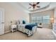 Comfortable bedroom featuring neutral carpet, modern ceiling fan, and a large window at 1151 Donelea Nw Ln, Concord, NC 28027