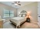 Comfortable bedroom with neutral carpet, a ceiling fan, and window with blind coverings at 1151 Donelea Nw Ln, Concord, NC 28027