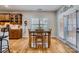 This dining room features hardwood floors, a window, and a dark wood dining table at 1151 Donelea Nw Ln, Concord, NC 28027