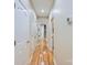 Inviting hallway with hardwood floors and neutral paint, leading to various rooms in the home at 1151 Donelea Nw Ln, Concord, NC 28027