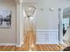 Inviting hallway featuring beautiful hardwood floors, molding, and access to various rooms at 1151 Donelea Nw Ln, Concord, NC 28027