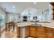 Kitchen area shows cabinets, stainless steel dishwasher and dining table with an open space view at 1151 Donelea Nw Ln, Concord, NC 28027