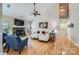 Spacious living room with hardwood floors, vaulted ceiling, fireplace and staircase at 1151 Donelea Nw Ln, Concord, NC 28027