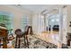 Spacious living area showcasing hardwood floors, crown molding, and views into the entryway at 1151 Donelea Nw Ln, Concord, NC 28027