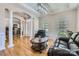 Bright living room featuring hardwood floors, crown molding, and stylish furnishings for comfortable living at 1151 Donelea Nw Ln, Concord, NC 28027