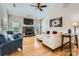 Bright living room shows a stone fireplace and white furniture with hardwood floors at 1151 Donelea Nw Ln, Concord, NC 28027