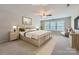 Bright main bedroom with large windows, neutral colors, and carpeted floor creating a soothing atmosphere at 1151 Donelea Nw Ln, Concord, NC 28027