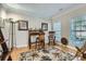 Well-lit office space featuring hardwood floors, crown molding, and two windows with plantation shutters at 1151 Donelea Nw Ln, Concord, NC 28027