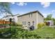 Back exterior featuring a patio, basketball hoop, and lush green lawn at 117 Tom Sawyer Ln, Mount Holly, NC 28120