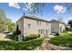 Back exterior showcasing a spacious lawn, patio and exterior finishes at 117 Tom Sawyer Ln, Mount Holly, NC 28120