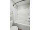 This bathroom is highlighted by a bathtub and shower with a sleek, all-white design at 117 Tom Sawyer Ln, Mount Holly, NC 28120
