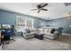 Upstairs living room with comfortable seating, a fan, and plenty of space at 117 Tom Sawyer Ln, Mount Holly, NC 28120