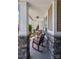 Inviting front porch with comfortable seating and charming stone pillars at 117 Tom Sawyer Ln, Mount Holly, NC 28120