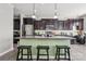 Spacious kitchen island, dark cabinets, and a modern design at 117 Tom Sawyer Ln, Mount Holly, NC 28120