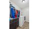 Convenient laundry room area complete with washer, dryer, and storage cabinets at 117 Tom Sawyer Ln, Mount Holly, NC 28120