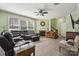 Spacious living room featuring a fireplace, ample natural light, and hardwood flooring at 117 Tom Sawyer Ln, Mount Holly, NC 28120