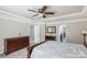 Spacious main bedroom with carpet floors, a dresser, and a ceiling fan at 117 Tom Sawyer Ln, Mount Holly, NC 28120