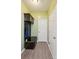Functional mudroom with built-in storage bench and coat rack, offering organization and convenience at 117 Tom Sawyer Ln, Mount Holly, NC 28120