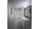 Bathroom features granite countertop vanity, framed mirror and tub shower at 12719 Cottonville Rd, Norwood, NC 28128