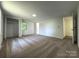 Spacious carpeted bedroom with closet and two windows at 12719 Cottonville Rd, Norwood, NC 28128
