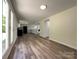 Spacious living room featuring wood-look flooring and ample natural light at 12719 Cottonville Rd, Norwood, NC 28128