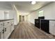 Open floor plan featuring wood-look flooring and a view to the kitchen at 12719 Cottonville Rd, Norwood, NC 28128