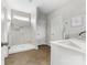 Modern bathroom featuring a walk-in shower and sleek vanity at 132 Moores Branch Rd, Mount Holly, NC 28120