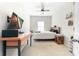 Cozy bedroom with neutral carpet, a ceiling fan, and a mounted TV, creating a relaxing and functional space at 132 Moores Branch Rd, Mount Holly, NC 28120