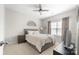 Comfortable bedroom with soft carpet, a queen-sized bed, and a window view at 132 Moores Branch Rd, Mount Holly, NC 28120